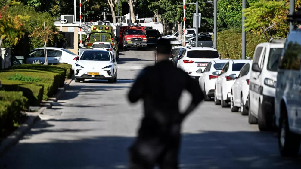 A member of Israeli security personnel stands at the entrance to a street, following a drone attack from Lebanon towards Israel amid ongoing hostilities between Hezbollah and Israel, in Caesarea, Israel, October 19, 2024 REUTERS/Rami Shlush  ISRAEL OUT. NO COMMERCIAL OR EDITORIAL SALES IN ISRAEL