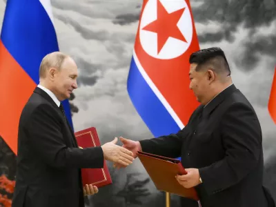 FILE - Russian President Vladimir Putin, left, and North Korea's leader Kim Jong Un exchange documents during a signing ceremony of the new partnership in Pyongyang, North Korea, on June 19, 2024. (Kristina Kormilitsyna, Sputnik, Kremlin Pool Photo via AP, File)