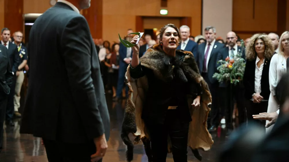 Australian Senator Lidia Thorpe stages a protest as Britain's King Charles and Queen Camilla attend a Parliamentary reception in Canberra, Australia - 21 Oct 2024. Victoria Jones/Pool via REUTERS