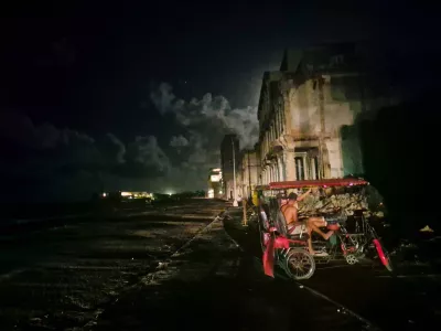 20 October 2024, Cuba, Havana: Two men sit in a bicycle cab during a blackout in Havana, following the failure of a major power plant. Hurricane Oscar on Sunday evening made landfall in Cuba, where much of the population has been without power for over 50 hours due to the collapse of the country's outdated power grid. Photo: Nick Kaiser/dpa