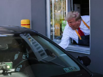 Republican presidential nominee and former U.S. President Donald Trump serves food at a McDonalds restaurant in Feasterville-Trevose, Pennsylvania, U.S. October 20, 2024. REUTERS/Brian Snyder    TPX IMAGES OF THE DAY   REFILE - REMOVING REFERENCE TO CUSTOMER