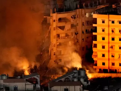 Flame and smoke rise from buildings hit by Israeli airstrikes on Dahiyeh, in the southern suburb of Beirut, Lebanon, Wednesday, Oct. 23, 2024. (AP Photo/Hussein Malla)