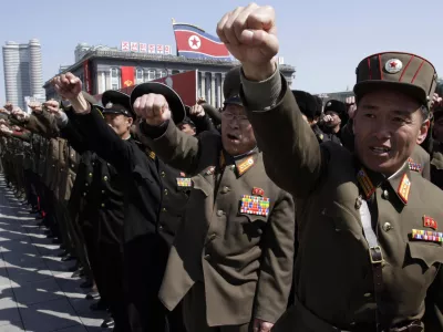 ﻿North Korean army officers punch the air as they chant slogans during a rally at Kim Il Sung Square in downtown Pyongyang, North Korea, Friday, March 29, 2013. Tens of thousands of North Koreans turned out for the mass rally at the main square in Pyongyang in support of their leader Kim Jong Un's call to arms. (AP Photo/Jon Chol Jin)