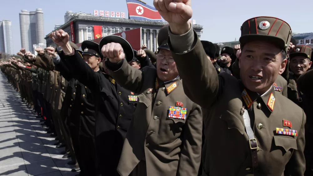 ﻿North Korean army officers punch the air as they chant slogans during a rally at Kim Il Sung Square in downtown Pyongyang, North Korea, Friday, March 29, 2013. Tens of thousands of North Koreans turned out for the mass rally at the main square in Pyongyang in support of their leader Kim Jong Un's call to arms. (AP Photo/Jon Chol Jin)