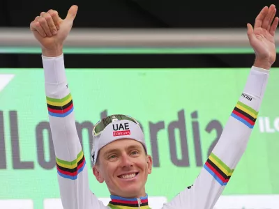 Reigning World Champion Slovenia's Tadej Pogacar celebrates winning Il Lombardia, Tour of Lombardy cycling race, in Como, Italy, Saturday, Oct. 12, 2024. (Spada/LaPresse via AP)