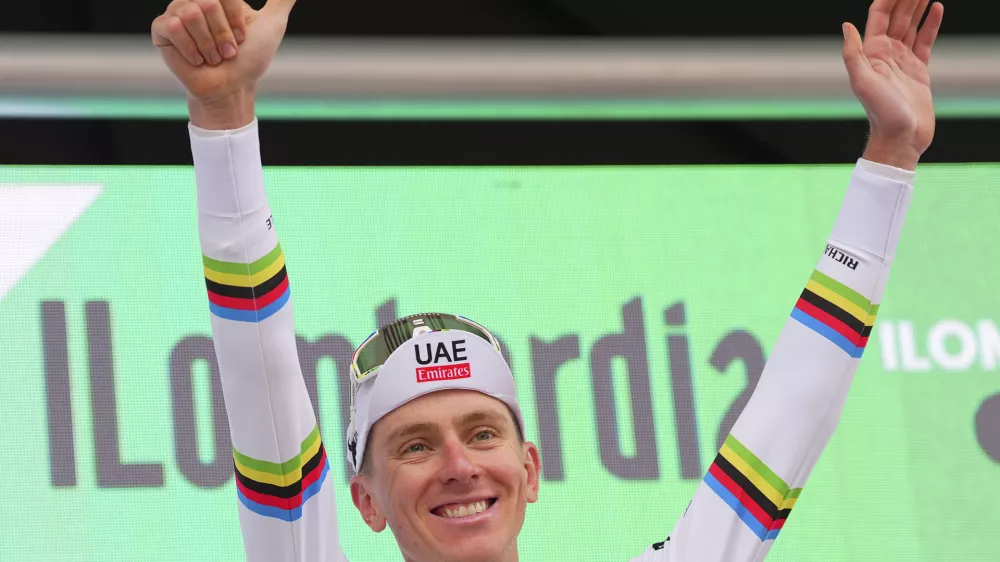 Reigning World Champion Slovenia's Tadej Pogacar celebrates winning Il Lombardia, Tour of Lombardy cycling race, in Como, Italy, Saturday, Oct. 12, 2024. (Spada/LaPresse via AP)