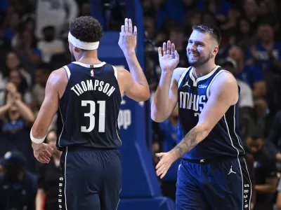 Oct 24, 2024; Dallas, Texas, USA; Dallas Mavericks guard Klay Thompson (31) and guard Luka Doncic (77) celebrate during the second half against the San Antonio Spurs at the American Airlines Center. Mandatory Credit: Jerome Miron-Imagn Images