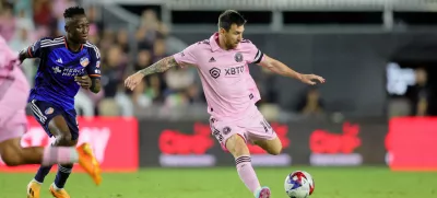 Oct 7, 2023; Fort Lauderdale, Florida, USA; Inter Miami CF forward Lionel Messi (10) dribbles the ball against FC Cincinnati midfielder Obinna Nwobodo (5) during the second half at DRV PNK Stadium. Mandatory Credit: Sam Navarro-USA TODAY Sports