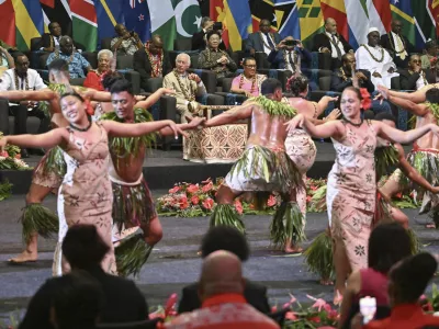 Britain's King Charles III, center, watches as dancers perform during the opening ceremony for the Commonwealth Heads of Government Meeting (CHOGM) in Apia, Samoa, on Friday, Oct. 25, 2024. (AP Photo/William West, Pool)