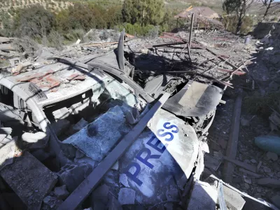 Destroyed vehicles used by journalists at the site where an Israeli airstrike hit a compound housing journalists, killing three media staffers from two different news agencies according to Lebanon's state-run National News Agency, in Hasbaya village, southeast Lebanon, Friday, Oct. 25, 2024. (AP Photo/Mohammed Zaatari)