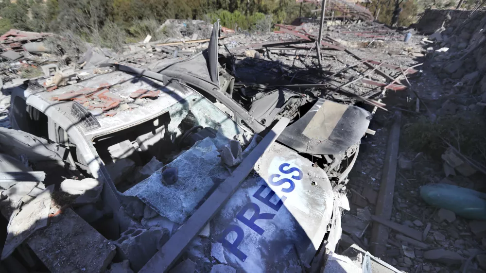 Destroyed vehicles used by journalists at the site where an Israeli airstrike hit a compound housing journalists, killing three media staffers from two different news agencies according to Lebanon's state-run National News Agency, in Hasbaya village, southeast Lebanon, Friday, Oct. 25, 2024. (AP Photo/Mohammed Zaatari)