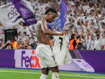 FILED - 22 October 2024, Spain, Madrid: Madrid's Vinicius Junior celebrates scoring his side's fourth goal during the UEFA Champions League soccer match between Real Madrid and Borussia Dortmund at the Santiago Bernabeu stadium. Photo: David Canales/dpa