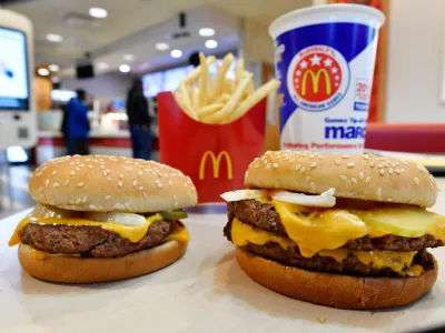 FILE- In this March 6, 2018, file photo, a McDonald's Quarter Pounder, left, and Double Quarter Pound burger is shown in Atlanta. (AP Photo/Mike Stewart, File)