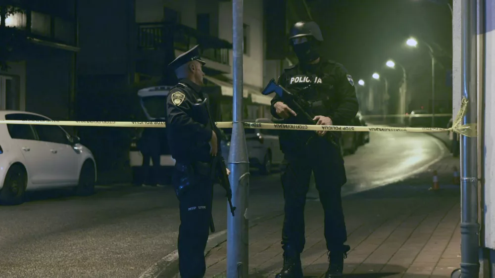 Bosnian police officer guard the local police station after a teenager broke and killed one officer with a knife and wounded another, in the town of Bosanska Krupa, 200 kilometers (120 miles) northwest of Bosnia's capital Sarajevo, Thursday, Oct. 24, 2024. (AP Photo/Edvin Zulic)