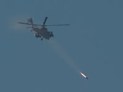 An Israeli Apache attack helicopter fires a missile towards southern Lebanon, amid ongoing hostilities between Hezbollah and Israel, as seen from near Ein Ya'akov, northern Israel, October 26, 2024. REUTERS/Gonzalo Fuentes