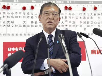 Japan's Prime Minister and president of the Liberal Democratic Party (LDP) Shigeru Ishiba speaks to the media regarding the early result of lower house election, at the LDP headquarters Sunday, Oct. 27, 2024, in Tokyo, (Kyodo News via AP)