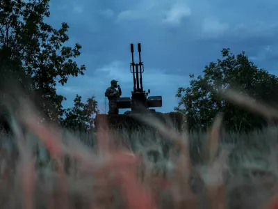 FILE PHOTO: A Ukrainian serviceman from an anti-drone mobile air defence unit smokes near a ZU-23-2 anti aircraft cannon as he waits for Russian kamikaze drones, amid Russia's attack on Ukraine, in Kherson region, Ukraine June 11, 2024. REUTERS/Ivan Antypenko/File Photo