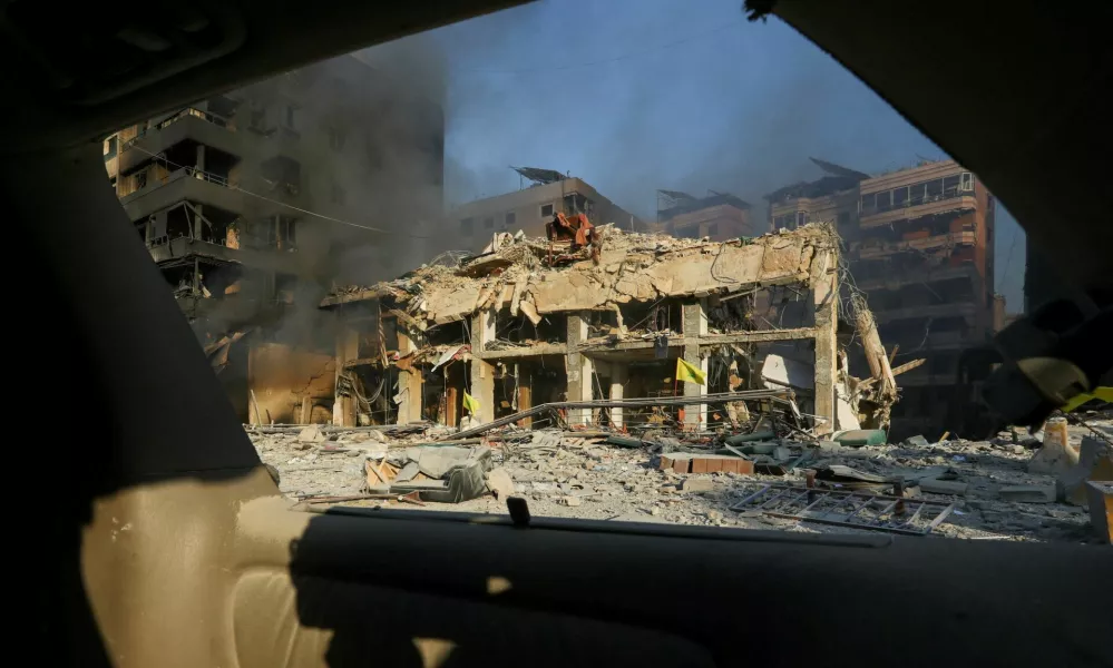 A damaged building is seen through a vehicle's window at a site damaged in the aftermath of Israeli strikes on Beirut's southern suburbs, amid the ongoing hostilities between Hezbollah and Israeli forces, Lebanon, October 27, 2024. REUTERS/Mohammed Yassin   TPX IMAGES OF THE DAY