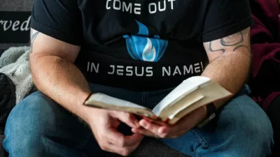 A member of Pastor Greg Locke's Global Vision Bible Church reads his Bible during church service in Mount Juliet, Tennessee, U.S. October 27, 2024. REUTERS/Seth Herald