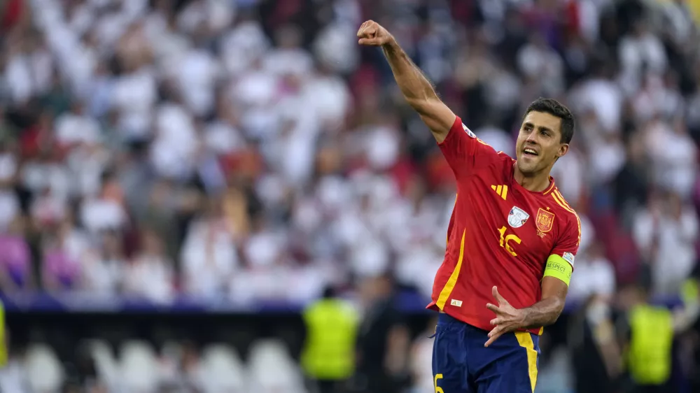 FILE - Spain's Rodri celebrates after a quarterfinal match between Germany and Spain at the Euro 2024 soccer tournament in Stuttgart, Germany, Friday, July 5, 2024. (AP Photo/Antonio Calanni, File)