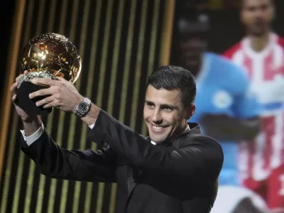 Manchester City's Spanish player Rodri receives the 2024 Men's Ballon d'Or award during the 68th Ballon d'Or (Golden Ball) award ceremony at Theatre du Chatelet in Paris, Monday, Oct. 28, 2024. (AP Photo/Michel Euler)