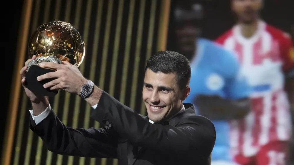 Manchester City's Spanish player Rodri receives the 2024 Men's Ballon d'Or award during the 68th Ballon d'Or (Golden Ball) award ceremony at Theatre du Chatelet in Paris, Monday, Oct. 28, 2024. (AP Photo/Michel Euler)