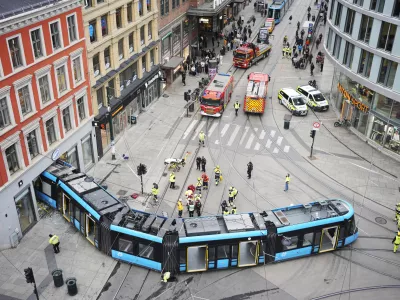 Emergency workers at the scene of a derailed tram that crashed into a building in downtown Oslo, Norway, Tuesday Oct. 29, 2024. (Terje Pedersen/NTB Scanpix via AP)