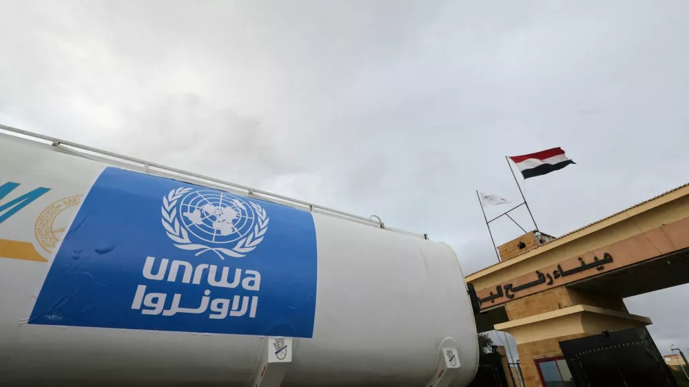 FILE PHOTO: A truck, marked with United Nations Relief and Works Agency (UNRWA) logo, crosses into Egypt from Gaza, at the Rafah border crossing between Egypt and the Gaza Strip, during a temporary truce between Hamas and Israel, in Rafah, Egypt, November 27, 2023. REUTERS/Amr Abdallah Dalsh/File Photo