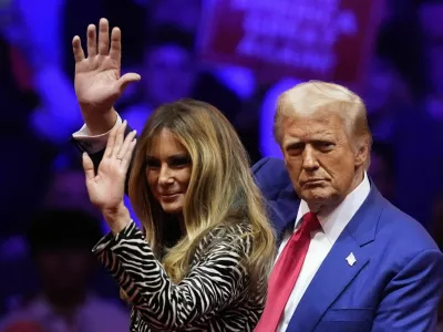 Republican presidential nominee former President Donald Trump and former first lady Melania Trump wave at a campaign rally at Madison Square Garden, Sunday, Oct. 27, 2024, in New York. (AP Photo/Evan Vucci)