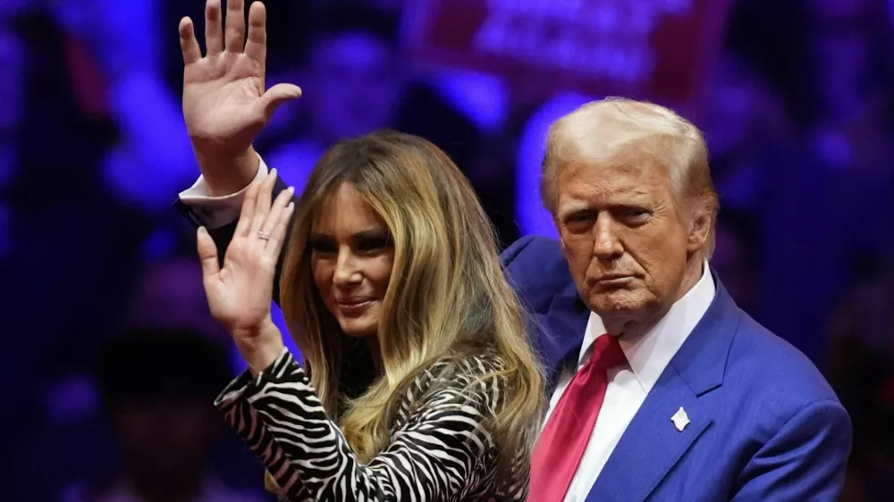 Republican presidential nominee former President Donald Trump and former first lady Melania Trump wave at a campaign rally at Madison Square Garden, Sunday, Oct. 27, 2024, in New York. (AP Photo/Evan Vucci)