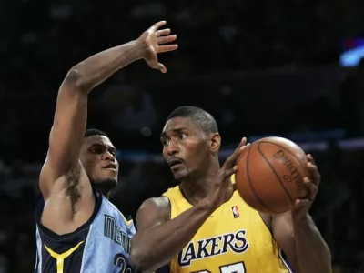 Los Angeles Lakers forward Ron Artest (37) takes the ball to the basket past Memphis Grizzlies forward Rudy Gay, left, during the second half of an NBA basketball game, Friday, Nov. 6, 2009, in Los Angeles. The Lakers won 114 to 98. (AP Photo/Lori Shepler)