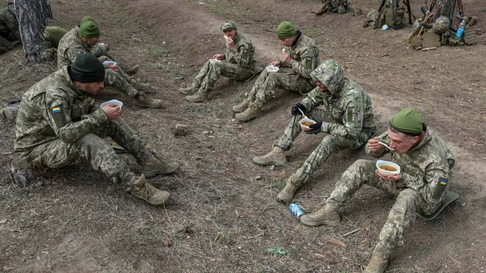 New recruits of the 126th Territorial Defence Brigade of the Ukrainian Armed Forces have lunch between military exercises at a training ground, amid Russia's attack on Ukraine, in an undisclosed location in southern Ukraine October 29, 2024. REUTERS/Ivan Antypenko