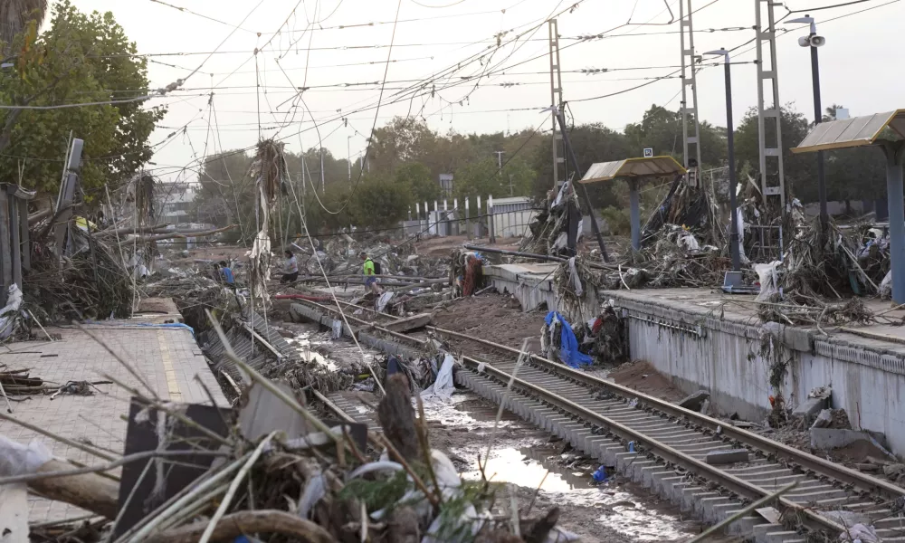 Train tracks are seen affected by floods in Paiporta, near Valencia, Spain, Wednesday, Oct. 30, 2024. (AP Photo/Alberto Saiz)