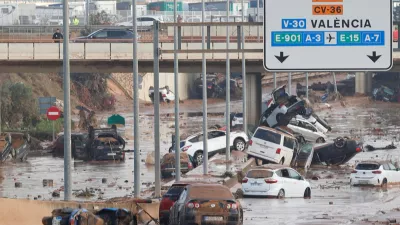 Damaged cars are seen along a road affected by torrential rains that caused flooding, on the outskirts of Valencia, Spain, October 31, 2024. REUTERS/Eva Manez