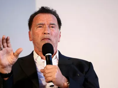 FILE PHOTO: Actor and former California Governor Arnold Schwarzenegger speaks, as he receives an honorary doctorate from the Hertie School, in Berlin, Germany, September 17, 2024. REUTERS/Liesa Johannssen/File Photo