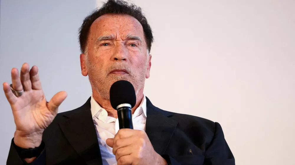 FILE PHOTO: Actor and former California Governor Arnold Schwarzenegger speaks, as he receives an honorary doctorate from the Hertie School, in Berlin, Germany, September 17, 2024. REUTERS/Liesa Johannssen/File Photo