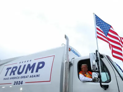 Republican presidential nominee and former U.S. President Donald Trump sits in a garbage truck, in Green Bay, Wisconsin, U.S., October 30, 2024. REUTERS/Brendan McDermid