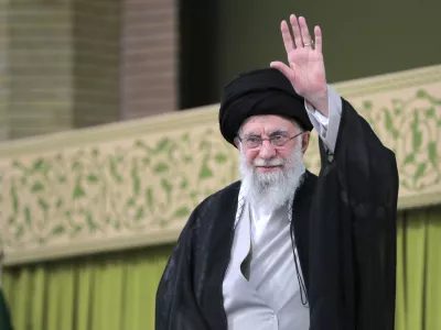 In this photo released by an official website of the office of the Iranian supreme leader, Supreme Leader Ayatollah Ali Khamenei waves to the crowd during a meeting with school and university students, in Tehran, Iran, Saturday, Nov. 2, 2024. (Office of the Iranian Supreme Leader via AP)