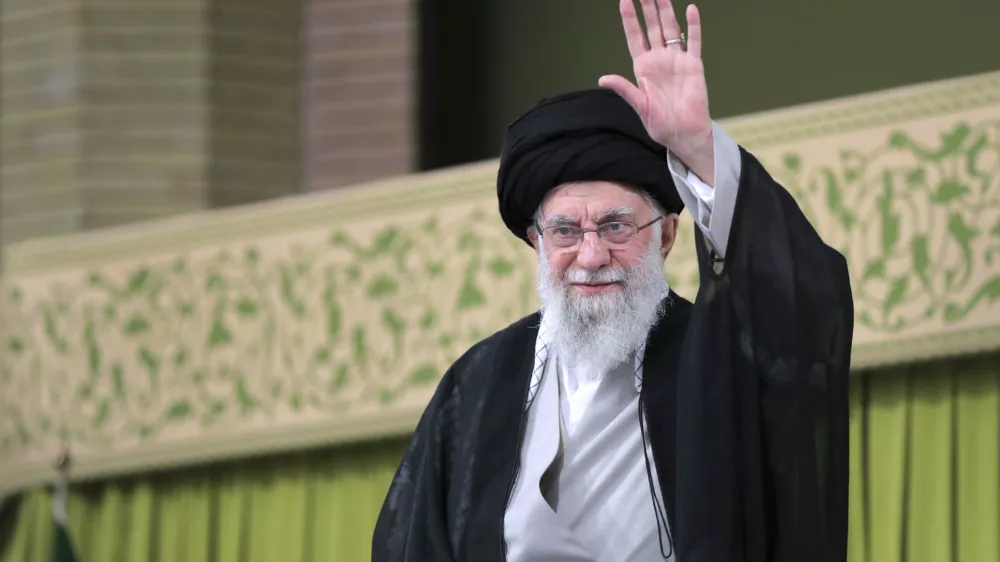 In this photo released by an official website of the office of the Iranian supreme leader, Supreme Leader Ayatollah Ali Khamenei waves to the crowd during a meeting with school and university students, in Tehran, Iran, Saturday, Nov. 2, 2024. (Office of the Iranian Supreme Leader via AP)