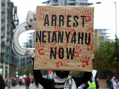 A person holds a sign, as protesters take part in a demonstration in support of Palestinians in Gaza, amid the ongoing Israel-Hamas conflict, in London, Britain, November 2, 2024. REUTERS/Mina Kim