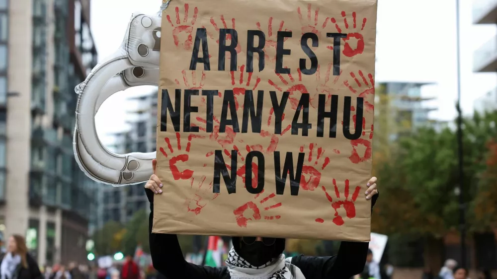 A person holds a sign, as protesters take part in a demonstration in support of Palestinians in Gaza, amid the ongoing Israel-Hamas conflict, in London, Britain, November 2, 2024. REUTERS/Mina Kim