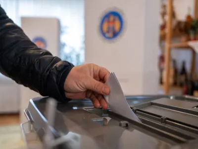 03 November 2024, Berlin: A man casts a ballot in the ballot box at the embassy of the Republic of Moldova for the 2024 Moldovan presidential run-off election. Photo: Christophe Gateau/dpa