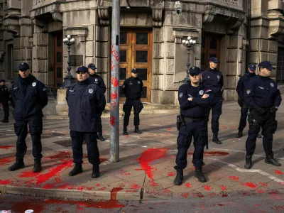 Members of police stand guard as demonstrators protest to commemorate an accident at a railway station in the Serbian city of Novi Sad, for which they blame negligence and corruption by the authorities, in front of the government in Belgrade, Serbia November 3, 2024. REUTERS/Marko Djurica