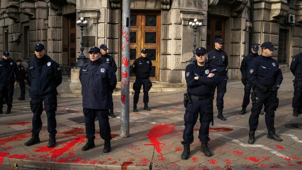 Members of police stand guard as demonstrators protest to commemorate an accident at a railway station in the Serbian city of Novi Sad, for which they blame negligence and corruption by the authorities, in front of the government in Belgrade, Serbia November 3, 2024. REUTERS/Marko Djurica