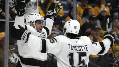 Los Angeles Kings center Anze Kopitar, left, celebrates with Alex Turcotte (15) after scoring against the Nashville Predators during the first period of an NHL hockey game Monday, Nov. 4, 2024, in Nashville, Tenn. (AP Photo/Mark Humphrey)