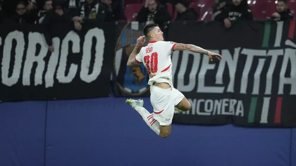 Leipzig's Benjamin Sesko celebrates after he scored during the UEFA Champions League opening phase soccer match between Leipzig and Juventus in Leipzig, Germany, Wednesday, Oct. 2, 2024.(AP Photo/Ebrahim Noroozi)