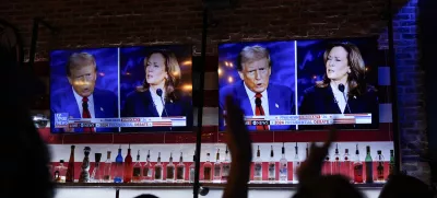 Viewers cheer as they watch a debate between Democratic presidential nominee Vice President Kamala Harris and Republican presidential nominee former President Donald Trump at the Angry Elephant Bar and Grill, Tuesday, Sept. 10, 2024, in San Antonio. (AP Photo/Eric Gay)