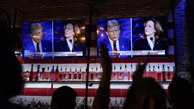 Viewers cheer as they watch a debate between Democratic presidential nominee Vice President Kamala Harris and Republican presidential nominee former President Donald Trump at the Angry Elephant Bar and Grill, Tuesday, Sept. 10, 2024, in San Antonio. (AP Photo/Eric Gay)