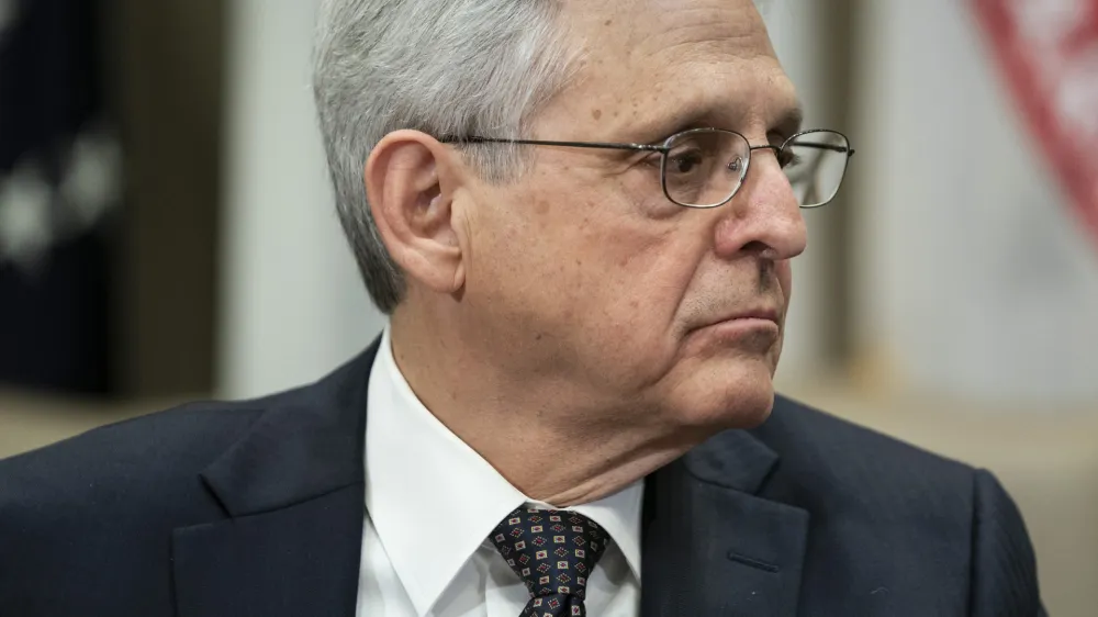 Attorney General Merrick Garland listens as Health and Human Services Secretary Xavier Becerra speaks during a meeting with a task force on reproductive health care access, in the Roosevelt Room of the White House, Wednesday, April 12, 2023, in Washington. (AP Photo/Evan Vucci)