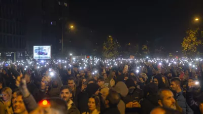 People light their mobile phones during a protest in Novi Sad, Serbia, Tuesday, Nov. 5, 2024. (AP Photo/Marko Drobnjakovic)